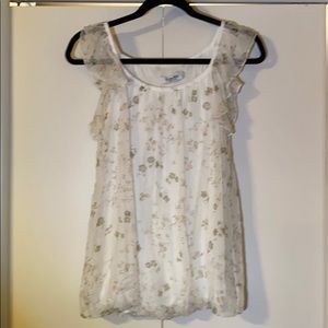 Floral and feminine shirt.